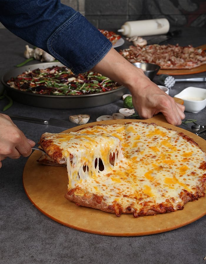 A cheese pull from a fresh Millcreek pizza