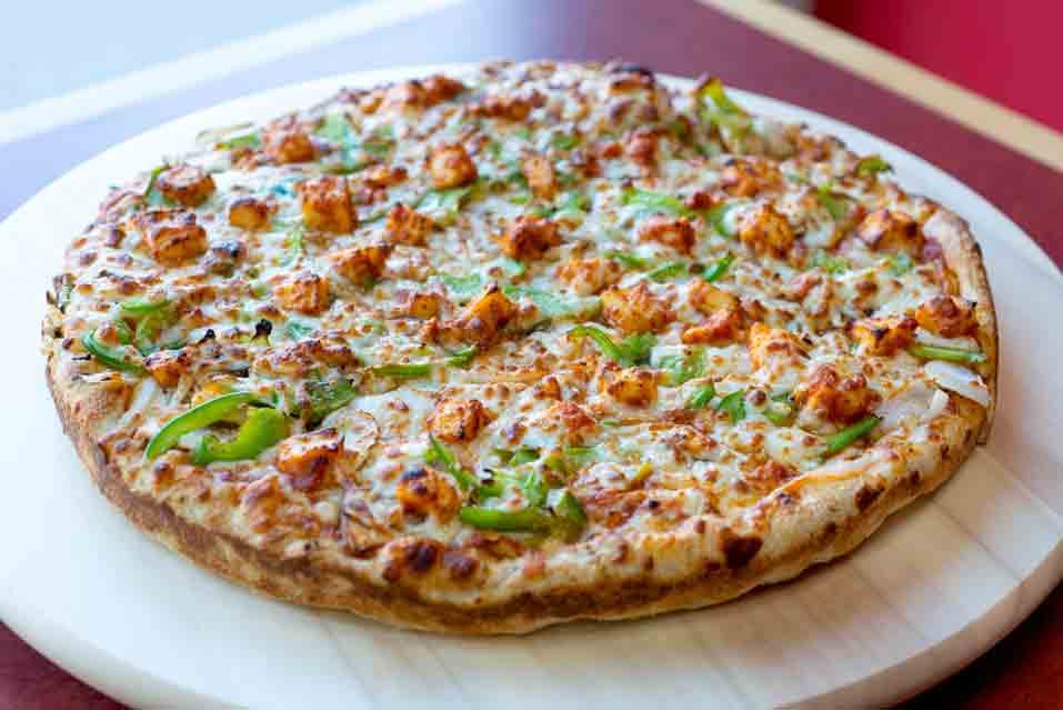 Shahi Paneer pizza with green peppers and onion